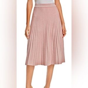 NANCY YANG PLEATED MIDI KNIT SKIRT IN PINK. Size M.